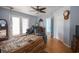 Large bedroom with hardwood floors, natural light, and access to the outside at 5865 Creekside Dr., Myrtle Beach, SC 29588