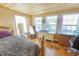Bedroom featuring three windows and hardwood floors at 5865 Creekside Dr., Myrtle Beach, SC 29588