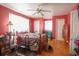 Comfortable bedroom with wood floors, a ceiling fan, and plenty of natural light at 5865 Creekside Dr., Myrtle Beach, SC 29588