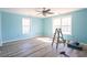 Bright bedroom featuring light blue walls, gray flooring and ample natural light at 5865 Creekside Dr., Myrtle Beach, SC 29588