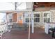 Inviting front porch with a swing and a decorative stone facade and orange door at 5865 Creekside Dr., Myrtle Beach, SC 29588