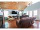 Bright living room with high ceilings, ceiling fans, French doors, and comfortable seating at 5865 Creekside Dr., Myrtle Beach, SC 29588