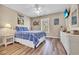 Bedroom features a queen bed, ceiling fan, TV, and white wicker furniture, exuding a cozy, beach-inspired feel at 6001-N50 S Kings Hwy., Myrtle Beach, SC 29575