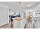 Open kitchen features a breakfast bar, seamlessly connects to the dining area and comfortable living room at 6001-N50 S Kings Hwy., Myrtle Beach, SC 29575
