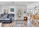 Living room and dining area with wood floors, comfortable seating, and ample natural light at 6001-N50 S Kings Hwy., Myrtle Beach, SC 29575