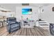 Cozy living room with modern entertainment setup and open view of the adjacent kitchen and dining at 6001-N50 S Kings Hwy., Myrtle Beach, SC 29575