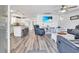 Bright living room features modern furniture, a large TV, and stylish decor at 6001-N50 S Kings Hwy., Myrtle Beach, SC 29575