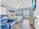 Main bedroom featuring a ceiling fan, sliding glass door leading to a balcony, and beachy decor at 6001-N50 S Kings Hwy., Myrtle Beach, SC 29575