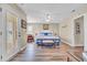 Bright main bedroom with a queen bed, decor, and access to a balcony at 6001-N50 S Kings Hwy., Myrtle Beach, SC 29575