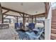 Spacious covered patio with outdoor seating, tables, and room for entertaining guests at 6001-N50 S Kings Hwy., Myrtle Beach, SC 29575