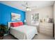 Comfortable bedroom with bright blue accent wall at 6001-Z-26 South Kings Hwy., Myrtle Beach, SC 29575