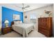 Charming bedroom featuring a blue accent wall, wicker furnishings, and a window for natural light at 6001-Z-26 South Kings Hwy., Myrtle Beach, SC 29575