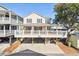 Charming coastal home featuring a spacious front porch and ample parking space underneath at 6001-Z-26 South Kings Hwy., Myrtle Beach, SC 29575