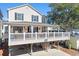 A beautiful beach home with a large front porch, offering a relaxing outdoor space at 6001-Z-26 South Kings Hwy., Myrtle Beach, SC 29575