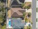 Aerial view of a home showing the roof, yard, pool, patio, palm trees, and proximity to neighbors at 606 5Th Ave. S, North Myrtle Beach, SC 29582