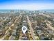 High aerial view of a neighborhood with the ocean and hotels visible in the background, and a pin on this home at 606 5Th Ave. S, North Myrtle Beach, SC 29582