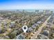 High aerial view of a neighborhood with the ocean and hotels visible in the background, and a pin on this home at 606 5Th Ave. S, North Myrtle Beach, SC 29582