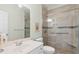Light-filled bathroom with tiled shower, modern fixtures, and a vanity with mirror at 606 5Th Ave. S, North Myrtle Beach, SC 29582