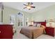 This bedroom features a ceiling fan, windows with shutters, and coordinating bedside tables at 606 5Th Ave. S, North Myrtle Beach, SC 29582