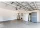 Spacious garage with ample storage space, including cabinets, refrigerator, and a water heater at 606 5Th Ave. S, North Myrtle Beach, SC 29582