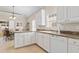 Bright kitchen features white cabinets, granite countertops, and stainless steel appliances for a modern feel at 606 5Th Ave. S, North Myrtle Beach, SC 29582