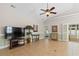 Bright living space with tile floors, a ceiling fan, and an open layout, creating a welcoming atmosphere at 606 5Th Ave. S, North Myrtle Beach, SC 29582