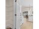 Spacious walk-in pantry with multiple wire shelves for optimal storage, open to the bright kitchen at 606 5Th Ave. S, North Myrtle Beach, SC 29582