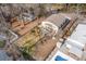 Aerial shot of a home with a spacious backyard, wooden deck, and in-ground pool at 613 Calhoun Dr., Murrells Inlet, SC 29576