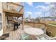 Backyard deck featuring outdoor seating, dining area, grill, and string lights at 613 Calhoun Dr., Murrells Inlet, SC 29576