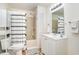 Bright bathroom featuring shower-tub combo with curtain and white vanity with sink at 613 Calhoun Dr., Murrells Inlet, SC 29576