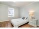 Cozy bedroom with a twin bed, side table with lamp, and light wood-look floors at 613 Calhoun Dr., Murrells Inlet, SC 29576
