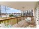 Relaxing deck with ample seating, lovely view and wooden railing at 613 Calhoun Dr., Murrells Inlet, SC 29576