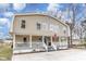 Charming two-story home with a welcoming front porch and American flag at 613 Calhoun Dr., Murrells Inlet, SC 29576