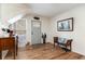 Welcoming foyer with wood-look floors, a charming bench, and tasteful decor at 613 Calhoun Dr., Murrells Inlet, SC 29576