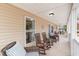 Inviting front porch with comfortable seating, perfect for relaxing and enjoying the outdoors at 613 Calhoun Dr., Murrells Inlet, SC 29576