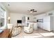 Inviting living room with kitchen, cozy seating, tile floors, and natural light at 613 Calhoun Dr., Murrells Inlet, SC 29576