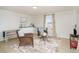 Cozy living area featuring tile floors, wicker chairs, and a small kitchenette with a sink at 613 Calhoun Dr., Murrells Inlet, SC 29576