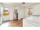 Mudroom area featuring a door to the backyard, hardwood floors, and updated appliances at 613 Calhoun Dr., Murrells Inlet, SC 29576