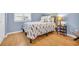 Well-lit bedroom featuring natural light, laminate wood floors, and a full size bed at 614 15Th Ave. S # 42, Surfside Beach, SC 29575