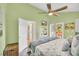 Bedroom featuring a ceiling fan, personal deck, and sliding door access at 614 15Th Ave. S # 42, Surfside Beach, SC 29575