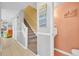Hallway view with stairs, doors, and beach-themed wall decorations at 614 15Th Ave. S # 42, Surfside Beach, SC 29575