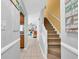 Hallway view with stairs leading up, open living room, and kitchen at 614 15Th Ave. S # 42, Surfside Beach, SC 29575