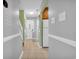Hallway view featuring tile floors and a staircase; kitchen to the right at 614 15Th Ave. S # 42, Surfside Beach, SC 29575
