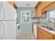 Bright kitchen features wooden cabinets, granite countertops, and white appliances at 614 15Th Ave. S # 42, Surfside Beach, SC 29575