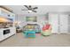 Cozy living room featuring a plush sofa, ceiling fan, and entertainment center at 614 15Th Ave. S # 42, Surfside Beach, SC 29575