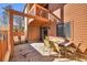 Outdoor patio with a table, chairs, and a glimpse of the building's exterior at 614 15Th Ave. S # 42, Surfside Beach, SC 29575