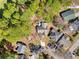An aerial view of a neighborhood, showcasing the layout of homes, driveways, and surrounding greenery at 6634 Cinnamon Fern Ln., Myrtle Beach, SC 29588