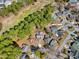 Aerial view of a property nestled among lush greenery in a quiet neighborhood at 6634 Cinnamon Fern Ln., Myrtle Beach, SC 29588
