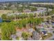 Overhead neighborhood shot with lush trees, varied house styles, and a glimpse of a nearby waterway at 6634 Cinnamon Fern Ln., Myrtle Beach, SC 29588