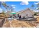 Charming backyard featuring a dining area, wood fence, and exterior of the home at 6634 Cinnamon Fern Ln., Myrtle Beach, SC 29588